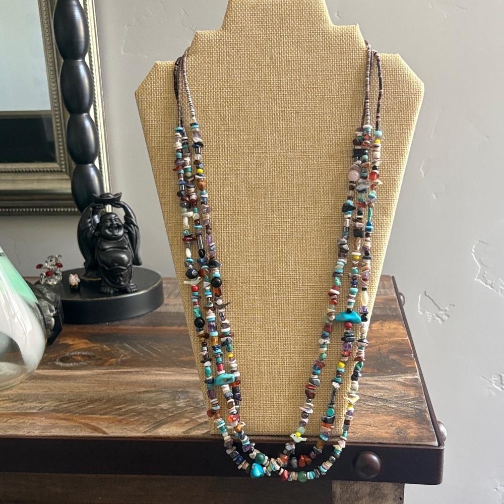 Handmade Zuni triple strand beaded necklace with bird fetishes.